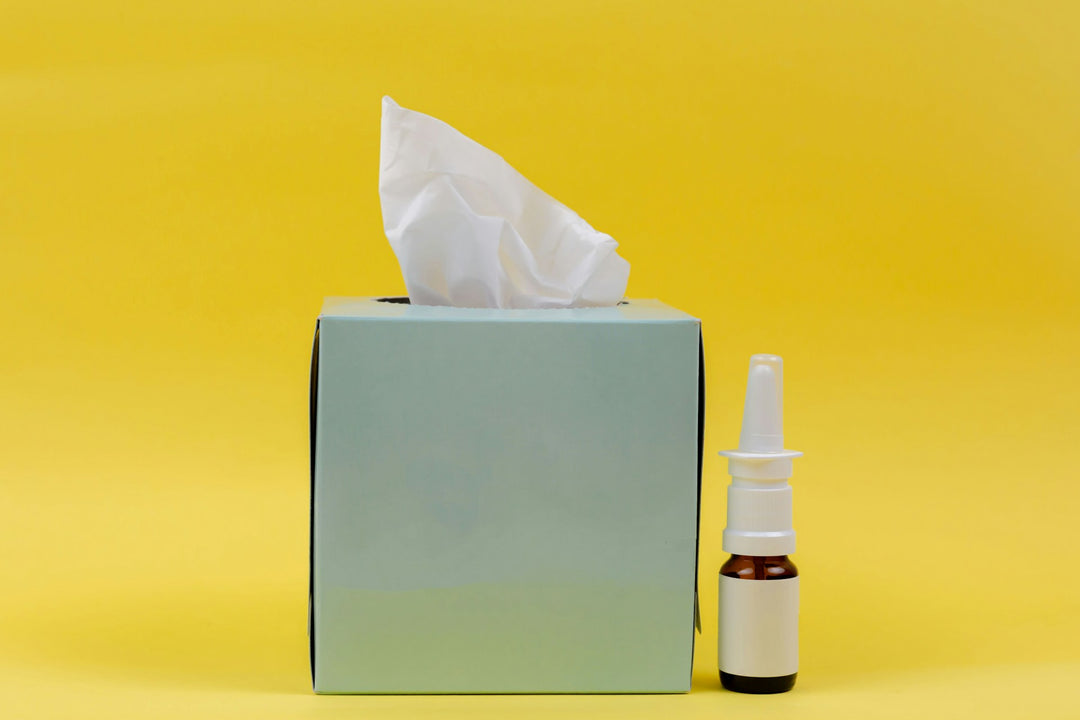 White and brown bottle next to disinfectant wipes box